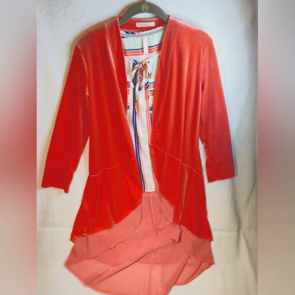 Orange, layered cape and sleeveless striped blouse